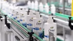 Dove pump action products on a factory production line enabled by AI for efficiency and productivity.