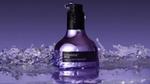 A bottle of Nexxus Keraphix Liquid Crystallizer. The bottle is a metallic silver-lilac colour with a black pump.
