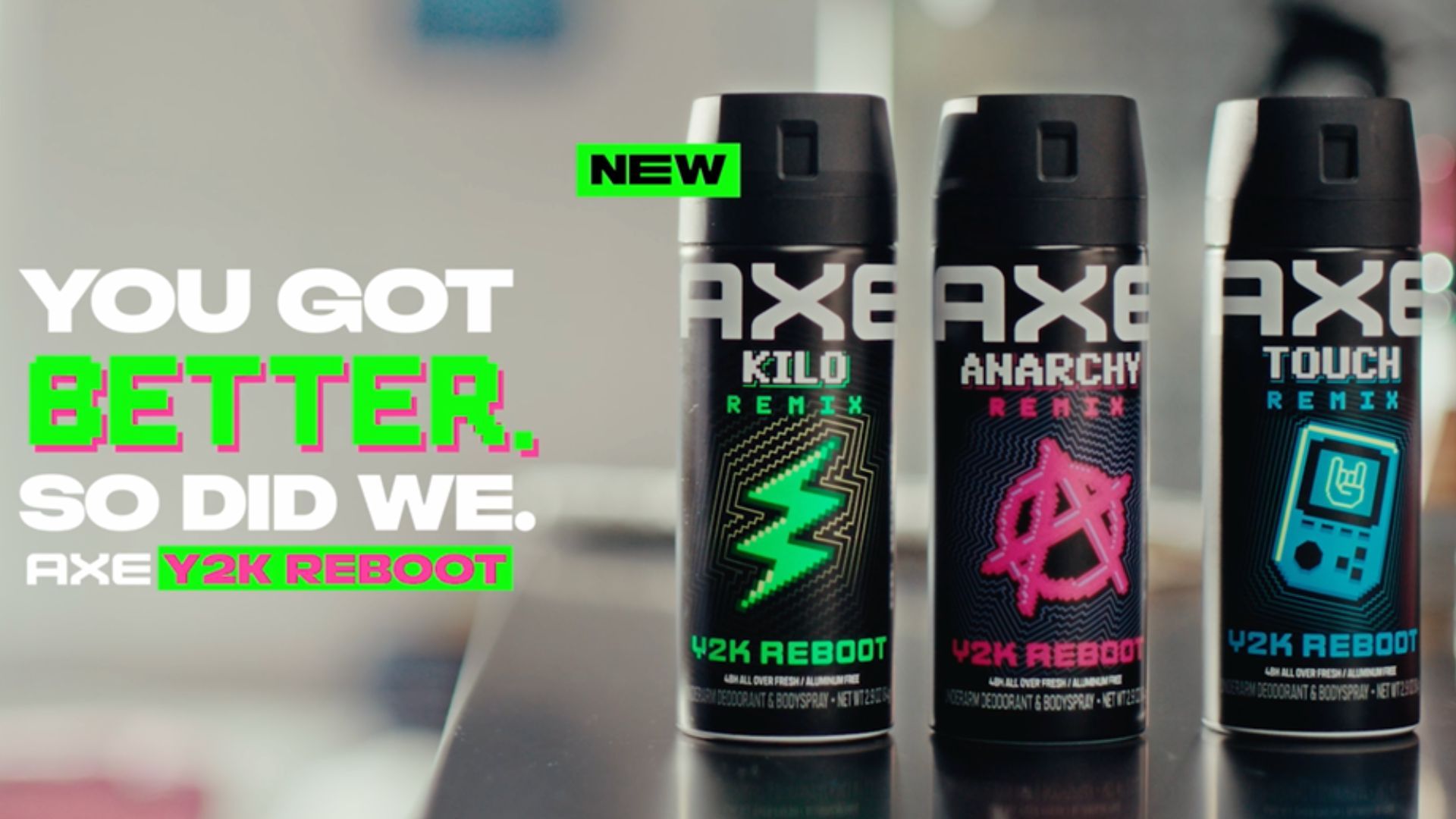 Three cans of AXE Y2K Reboot body spray in Kilo, Anarchy and Touch Remix scents.